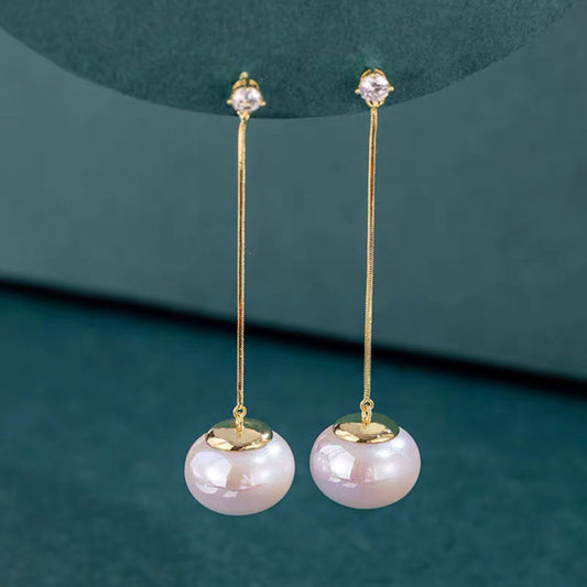 Boucles d'oreilles longues chic Moyyudé avec perles blanches pendantes et tiges dorées fines